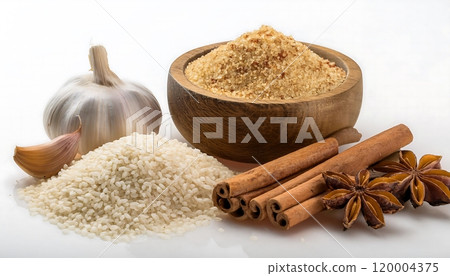 Various food ingredients such as garlic, cinnamon sticks, black pepper, white rice, couscous and a wooden jar with brown powder on a white background. Various food ingredients such as garlic, cinnamon sticks, black pepper, white rice, couscous and a wooden jar with brown powder on a white background. 120004375
