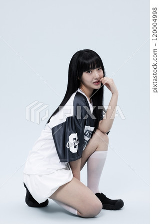 Korean Woman in Her 20s Poses On One Knee wearing In Block Core fashion 120004998