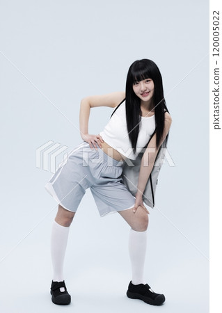 Korean Woman in 20s Poses Standing in Gray Shorts and bags 120005022