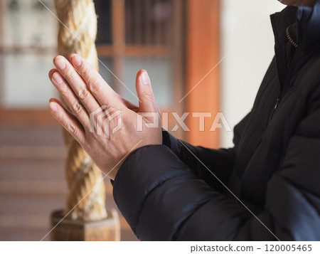 The hands and bell rope of a man praying (no face) The hands and bell rope of a man praying (no face) 120005465