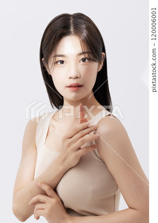a woman holding a lipstick in the sun 120006001