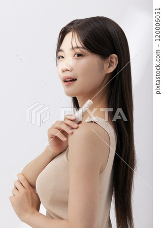 A woman posing with cosmetics A woman posing with cosmetics 120006051