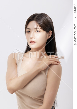 A woman posing with cosmetics A woman posing with cosmetics 120006053