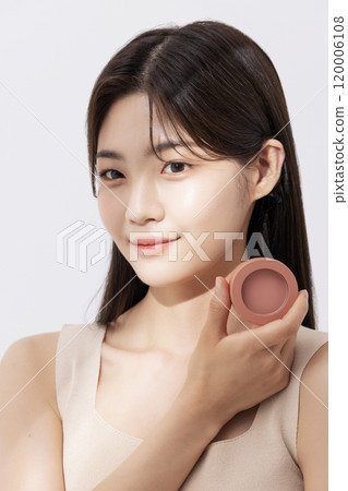 A woman posing with a blusher 120006108