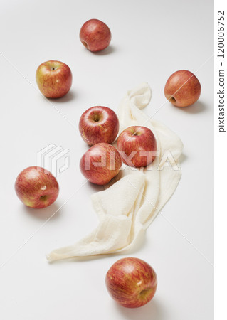 Several apples placed with a cloth on a white background 120006752