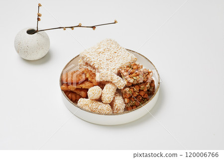 Korean traditional snacks piled high on a plate Korean traditional snacks piled high on a plate 120006766
