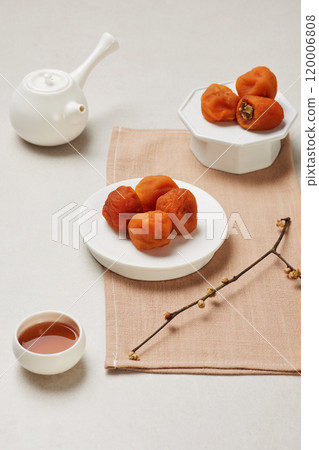 Luxurious plating of dried persimmons, a traditional Korean dessert Luxurious plating of dried persimmons, a traditional Korean dessert 120006808