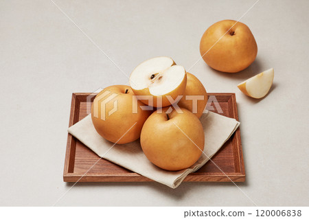 Pears packed on a wooden tray 120006838