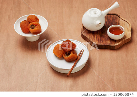 Luxurious plating of dried persimmons, a traditional Korean dessert Luxurious plating of dried persimmons, a traditional Korean dessert 120006874
