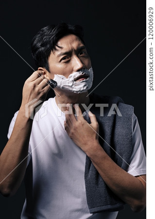 A middleaged man about to start shaving 120006929