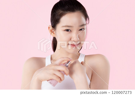Teenage woman posing with cosmetics Teenage woman posing with cosmetics 120007273