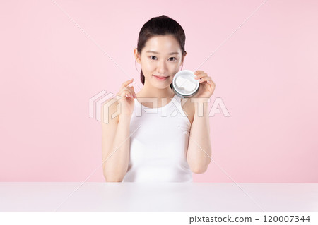 Teenage woman trying out nose pads Teenage woman trying out nose pads 120007344