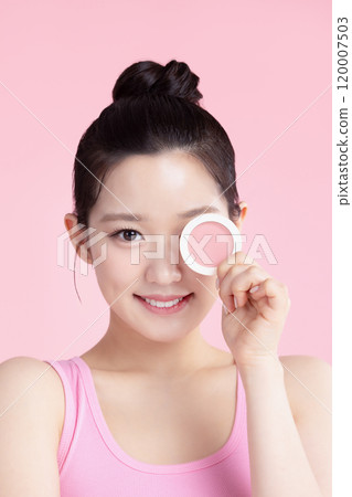A teenage woman posing with cosmetics A teenage woman posing with cosmetics 120007503