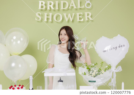 A woman in her 20s enjoying a bridal shower ahead of her wedding 120007776