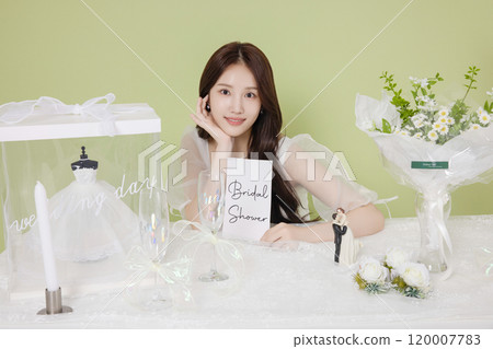 A woman in her 20s enjoying a bridal shower ahead of her wedding 120007783
