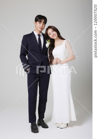 A beautiful couple in their 20s about to get married 120007820