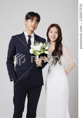 A beautiful couple in their 20s about to get married 120007838