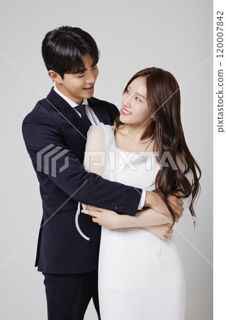 A beautiful couple in their 20s about to get married 120007842