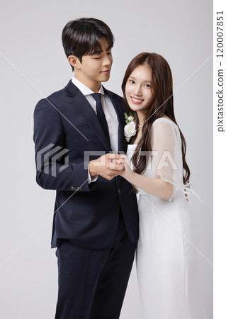 A beautiful couple in their 20s about to get married 120007851