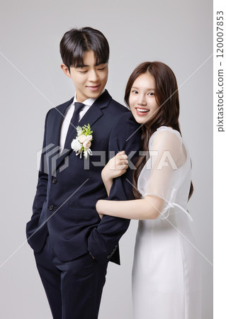 A beautiful couple in their 20s about to get married 120007853