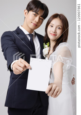 A beautiful couple in their 20s about to get married 120007861