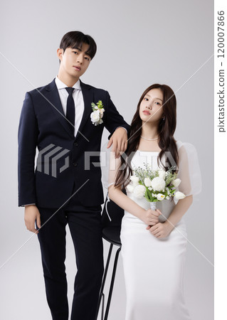 A beautiful couple in their 20s about to get married 120007866