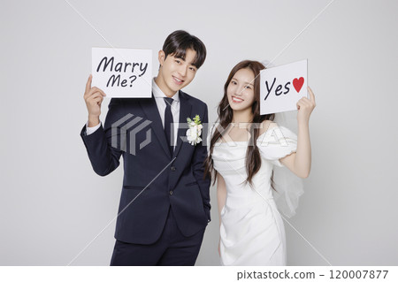 Newlyweds taking a wedding photo shoot 120007877