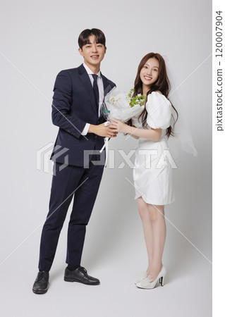 Newlyweds taking a wedding photo shoot 120007904