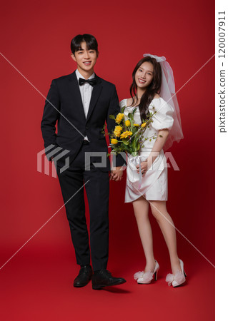 Newlyweds taking a wedding photo shoot 120007911