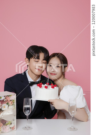 Newlywed couple smiling happily holding wedding cake 120007983