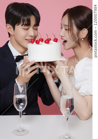 Newlywed couple smiling happily holding wedding cake Newlywed couple smiling happily holding wedding cake 120007984