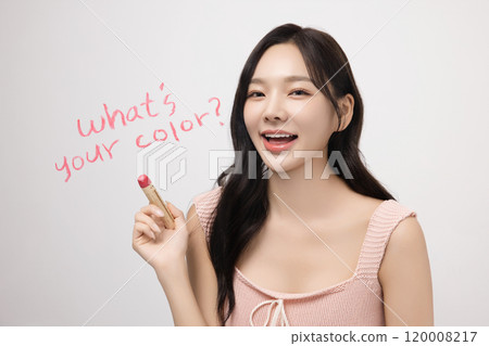 A woman in her 20s writing on a transparent wall with lipstick A woman in her 20s writing on a transparent wall with lipstick 120008217