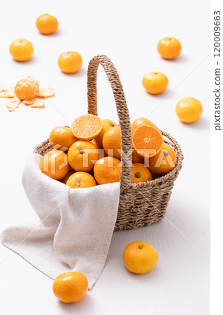 A basket full of fresh tangerines A basket full of fresh tangerines 120009663
