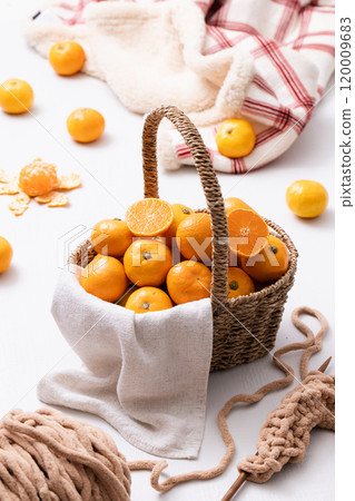 A basket full of fresh tangerines A basket full of fresh tangerines 120009683