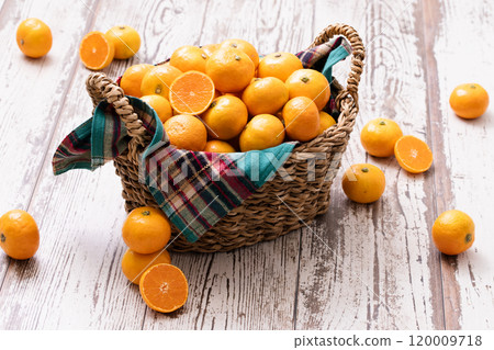 A basket full of fresh tangerines A basket full of fresh tangerines 120009718