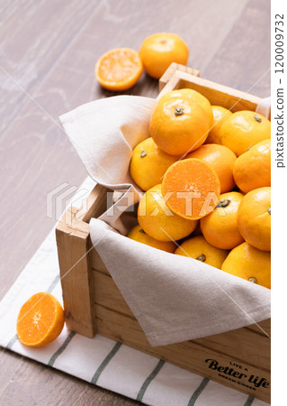 A box full of fresh tangerines A box full of fresh tangerines 120009732