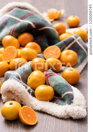Tangerines scattered on the blanket Tangerines scattered on the blanket 120009745