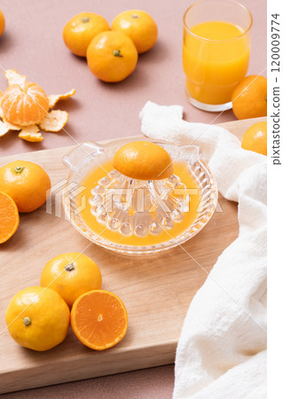 Making a drink with tangerines Making a drink with tangerines 120009774