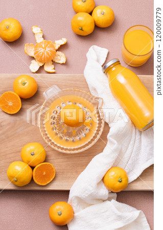 Making a drink with tangerines Making a drink with tangerines 120009779