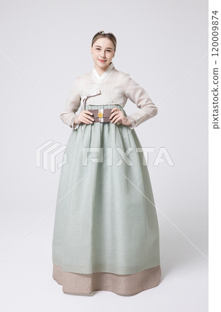 A foreign woman wearing traditional Korean hanbok holding a holiday gift A foreign woman wearing traditional Korean hanbok holding a holiday gift 120009874