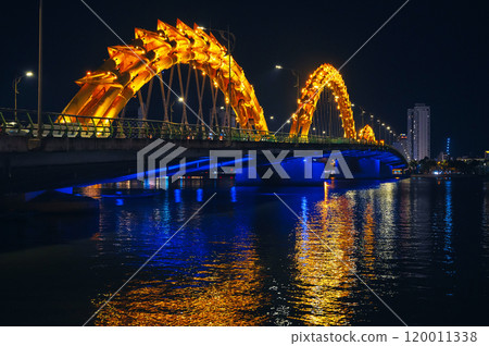 Dragon Bridge over Han River is famous landmark in city of Da Nang in Vietnam at night Dragon Bridge over Han River is famous landmark in city of Da Nang in Vietnam at night 120011338