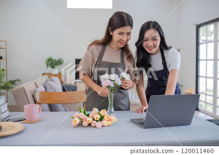 Mother and Daughter Bonding While Arranging Beautiful Flowers Together in a Cozy Home Setting Mother and Daughter Bonding While Arranging Beautiful Flowers Together in a Cozy Home Setting 120011460