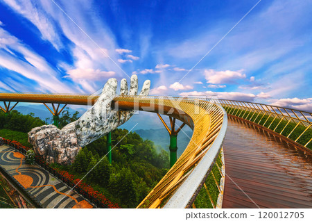 Golden Bridge of the Hand of Gods at Sun World Ba Na Hills amusement Park in Da Nang in Vietnam in summer Golden Bridge of the Hand of Gods at Sun World Ba Na Hills amusement Park in Da Nang in Vietnam in summer 120012705