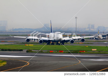 The wings are from Europe... Jumbo jet "B747" moving on the ground after landing The wings are from Europe... Jumbo jet "B747" moving on the ground after landing 120012860