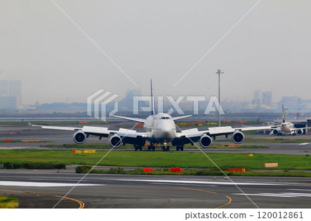 The wings are from Europe... Jumbo jet "B747" moving on the ground after landing The wings are from Europe... Jumbo jet "B747" moving on the ground after landing 120012861