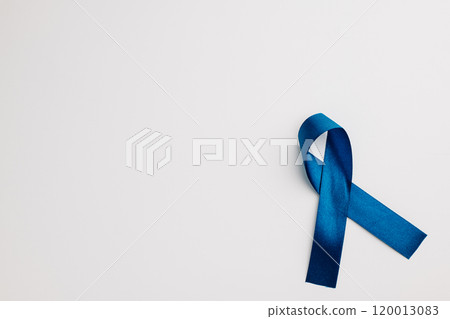 A bright blue ribbon, a symbol of world diabetes day on November 14, isolated on white. Copy space for messages of patient support and medical care. A bright blue ribbon, a symbol of world diabetes day on November 14, isolated on white. Copy space for messages of patient support and medical care. 120013083