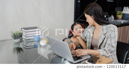 business woman work from home and take care of her child while working 120013117