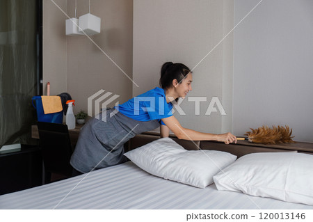 cleaning service woman worker clean bedroom at hotel. housekeeper cleaner feel happy and make bed look neat. housework and housekeeping cleaning service cleaning service woman worker clean bedroom at hotel. housekeeper cleaner feel happy and make bed look neat. housework and housekeeping cleaning service 120013146