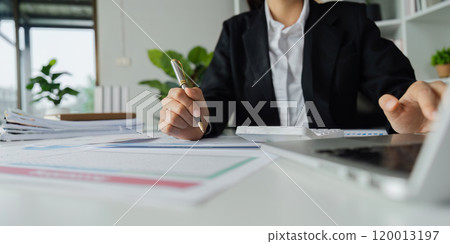 Accountant working on financial data analysis dashboard on paper as marketing indication for business strategic planning 120013197