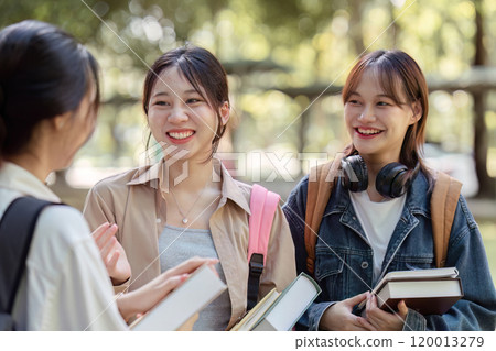 Group of Asian college student reading books and tutoring special class for exam at outdoors 120013279